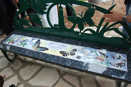 Outdoor tile murals on bench